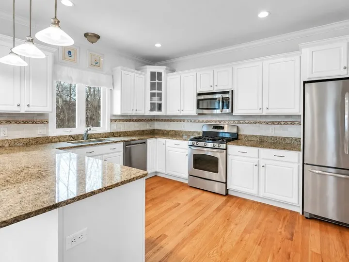 White painted kitchen cabinets by White Eagle Home Improvement
