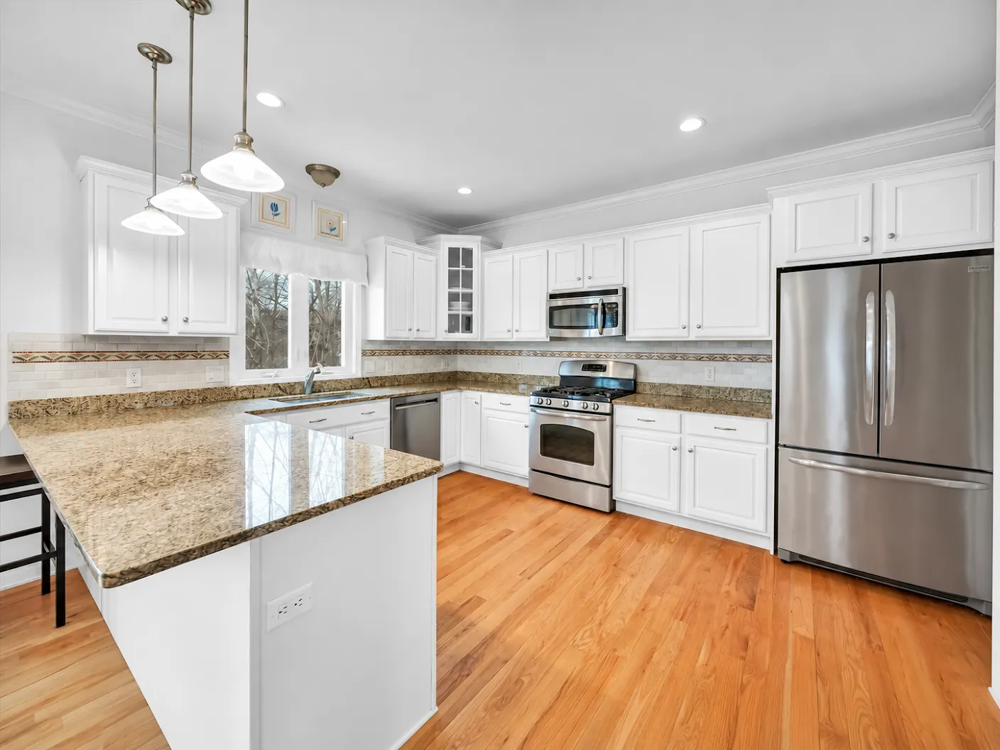 Finished white painted kitchen cabinets in a Central Connecticut home
